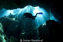 Cave diver doing deco stop in cenote chac mool by Javier Sandoval 